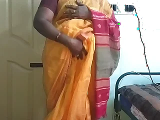 desi  indian simmering tamil telugu kannada malayalam hindi cheating wife vanitha wearing orange colour saree  showing big boobs and shaved pussy press hard boobs press nip scraping pussy masturbation